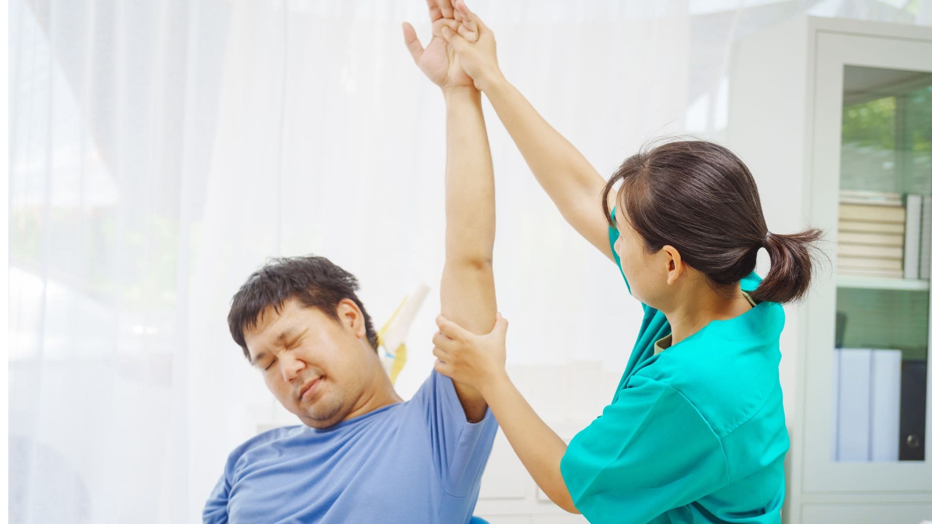 a-female-doctor-performs-physical-therapy (1)