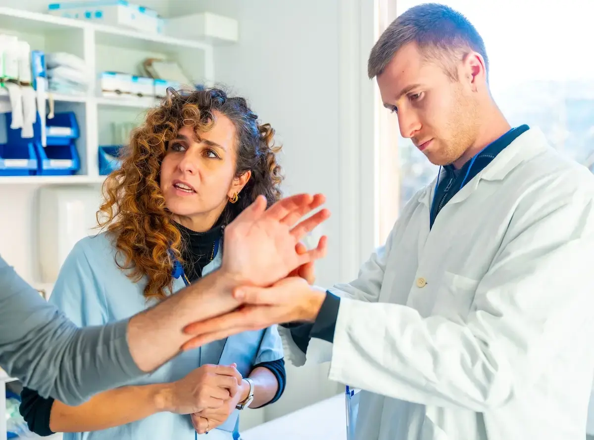 doctor-checking-the-injured-hand-of-a-patient-2024-12-10-00-45-41-utc